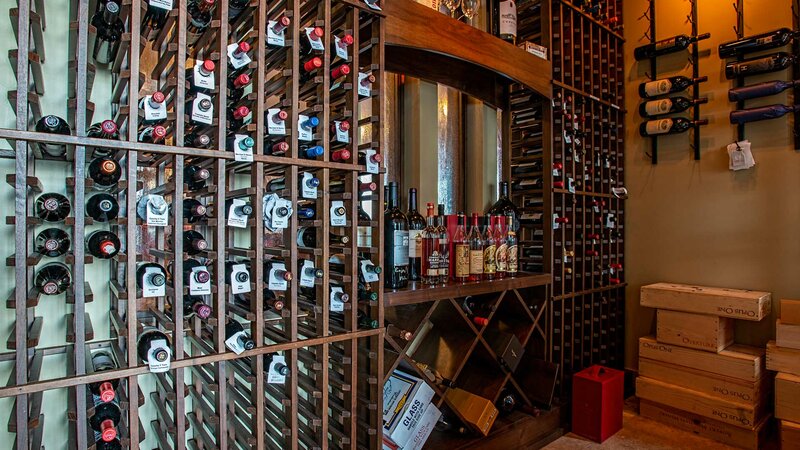Wine room with many bottles of wine and liquor